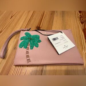 kate spade pink wristlet with green palm applique